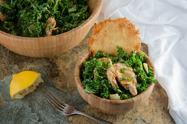 Buffalo Chicken Caesar Salad with Kale and Parmesan Cheese Crisps