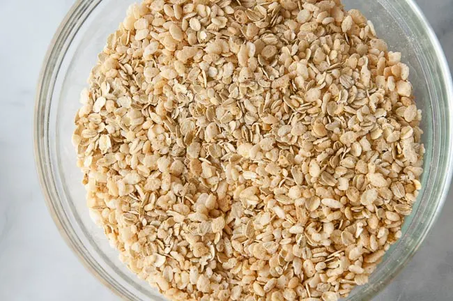 Toss the oats, cereal and graham cracker crumbs together in a separate bowl.