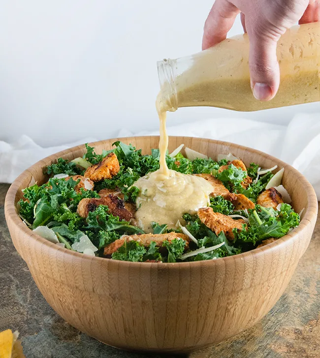 Buffalo Chicken Caesar Salad with Kale and Parmesan Cheese Crisps