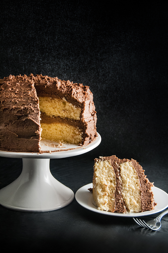 A slice of Bailey's cake loaded with thick layers of Bailey's infused chocolate frosting