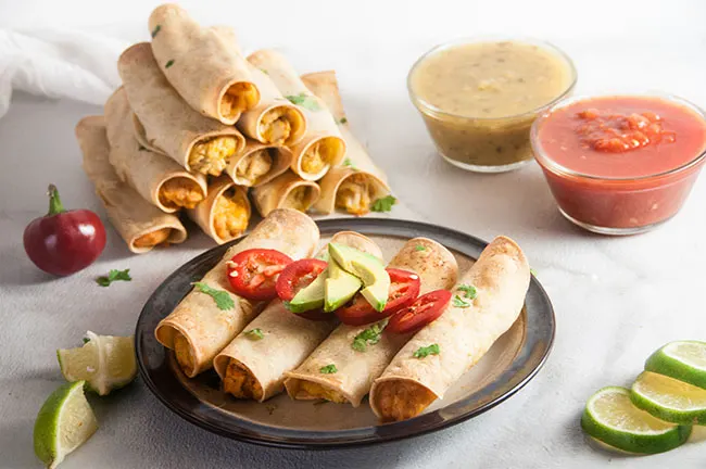 Easy Chicken Taquitos are a deliciously crunchy appetizer featuring corn tortillas, chicken and cheese and need only 5 ingredients to make. Perfect for parties, football games, or to switch up taco night!