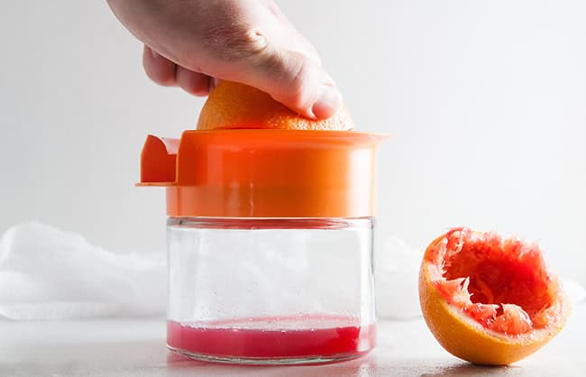 Blood oranges being juiced