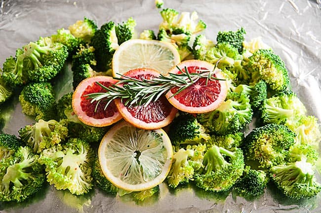 Broccoli ready to be roasted with blood oranges, lemon and rosemary