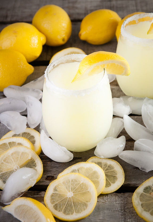 Boozy lemonade slushies are lemonade flavored alcoholic slushies perfect for barbecues, Memorial Day, Fourth of July, picnics, and more.