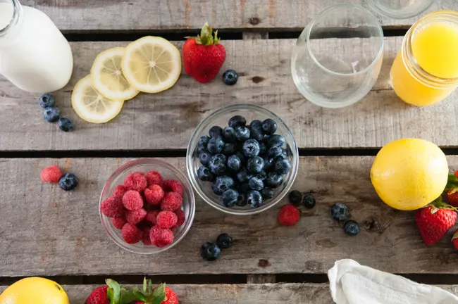 berries, lemons, orange juice and milk