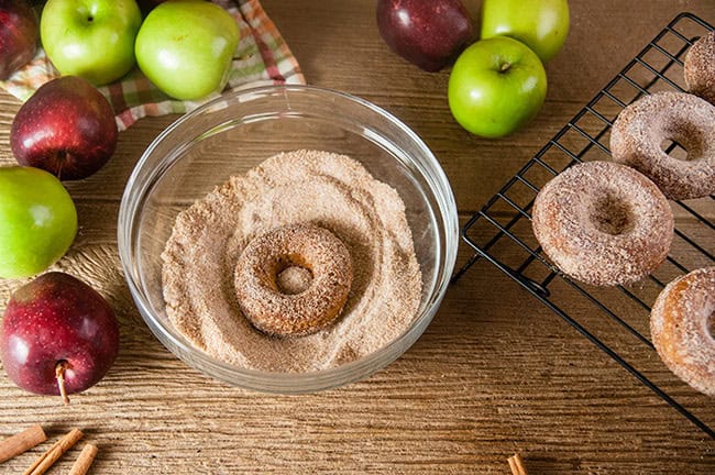 Roll the donuts in cinnamon sugar