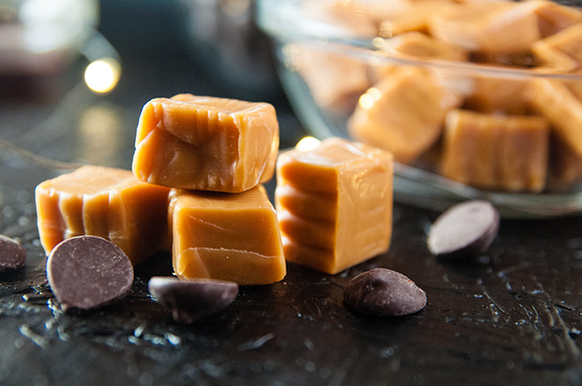 Caramels and dark chocolate chips on black