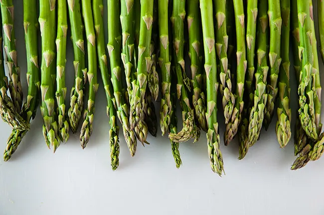 Asparagus spears on white