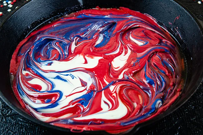 red white and blue melted candy swirled together