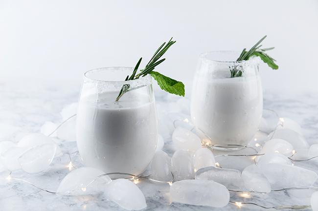 Christmas drink with coconut rum and mint