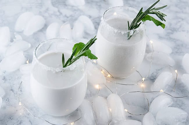 Christmas drink with coconut rum and mint