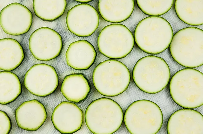 Zucchini slices on a paper towel