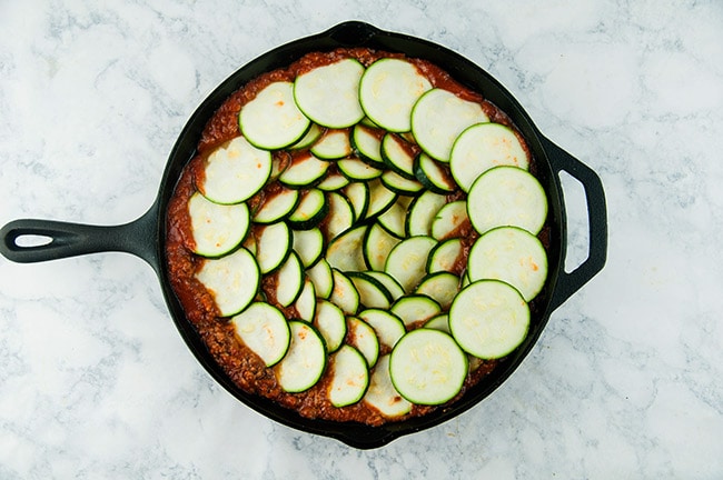 Zucchini in a skillet with meat sauce