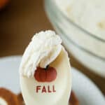 Boozy Pumpkin Spice Buttercream on a paddle that has a pumpkin on it