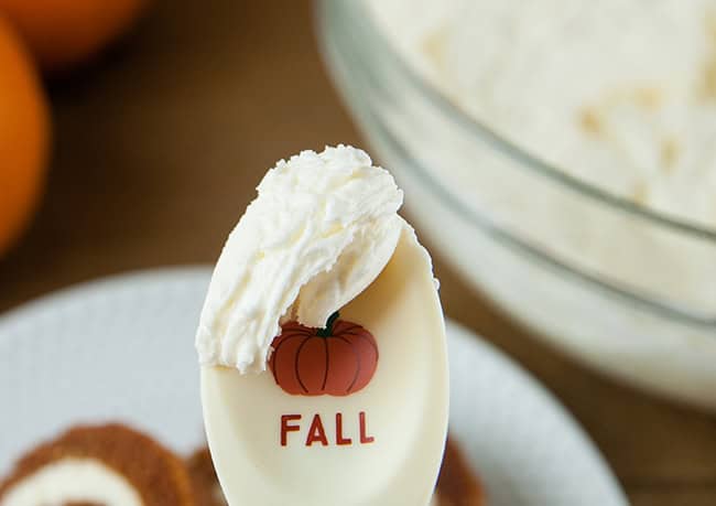 Boozy Pumpkin Spice Buttercream on a paddle that has a pumpkin on it