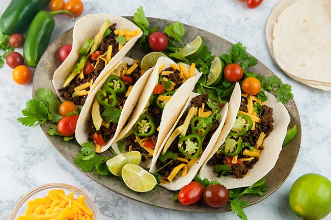 A platter of ground beef tacos