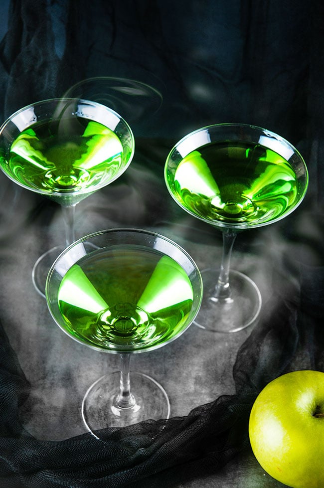 green martinis on black with smoke 