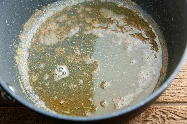 brown butter in a pot on wood