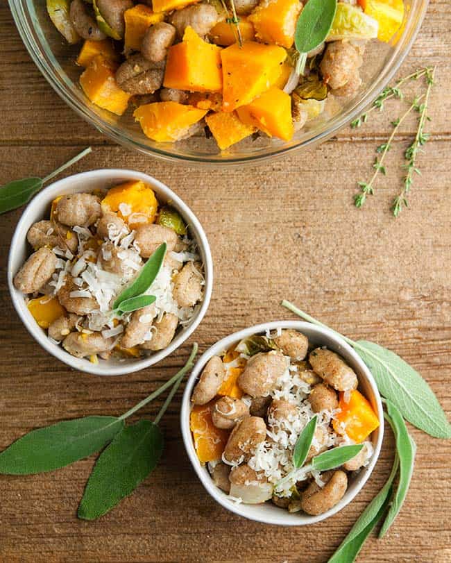 Roasted Sheet Pan Gnocchi and Fall Vegetables on wood with sage and thyme