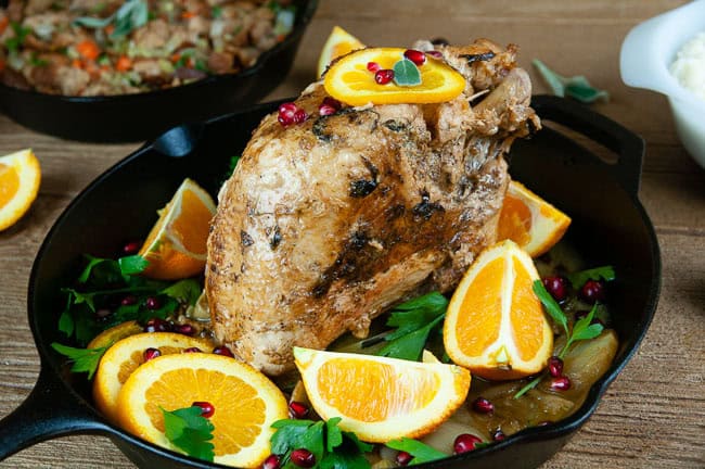 Get the turkey ready for the oven with more butter, olive oil, herbs, and aromatics