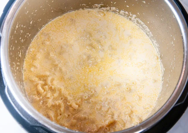 Pressure cooked heavy cream, water and macaroni in the inner liner of an Instant Pot
