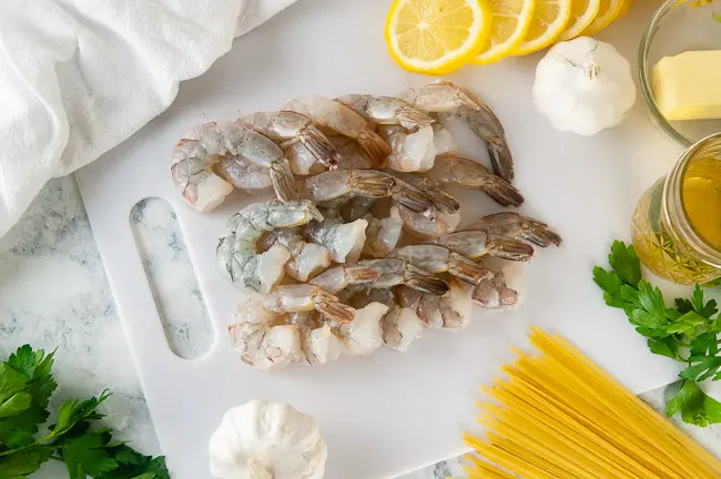 Ingredients for easy shrimp scampi- linguine, shrimp, lemon, garlic, butter
