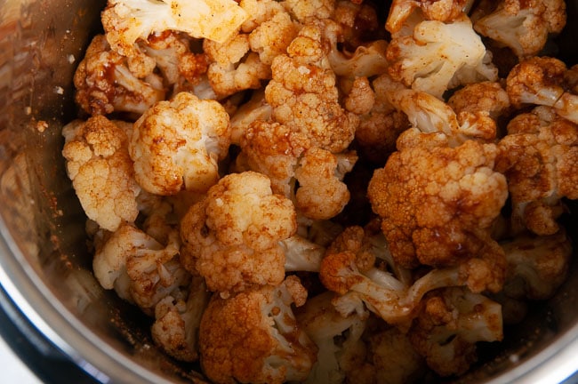 Break the cauliflower into florets and toss with sauce.
