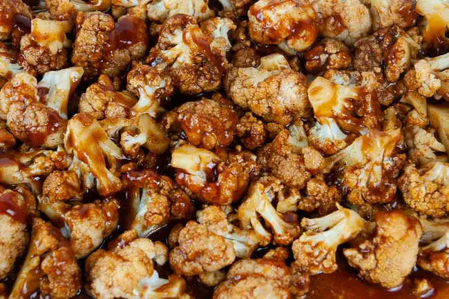 Highly recommend popping the cauliflower under the broiler for a couple minutes with some extra barbecue sauce for maximum smokiness.
