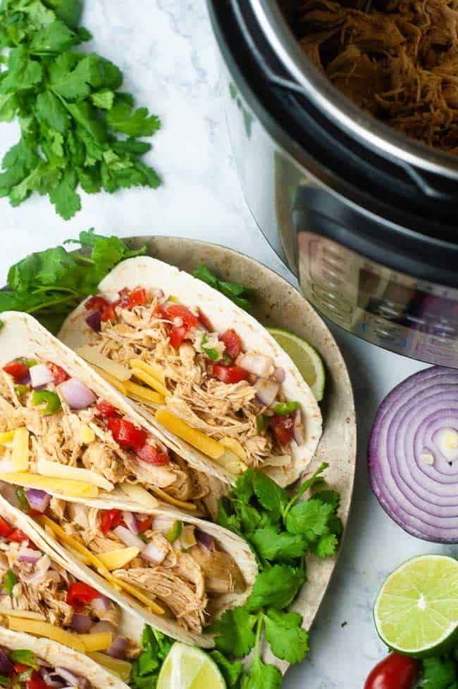 Instant Pot chicken tacos are the perfect solution for a quick, family friendly taco night.