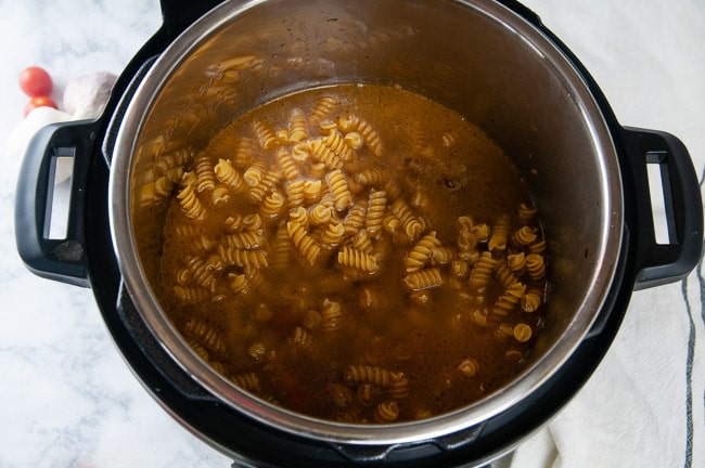 Add the pasta and the water to the Instant Pot