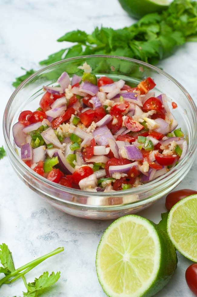 Fresh tomato salsa goes perfectly with chips, tacos or nachos