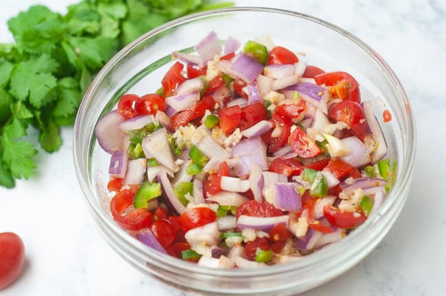 Fresh tomato salsa goes perfectly with chips, tacos or nachos