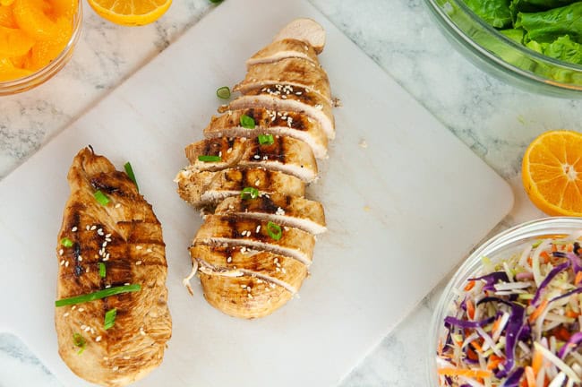 Slice the grilled chicken breasts for the mandarin chicken salad