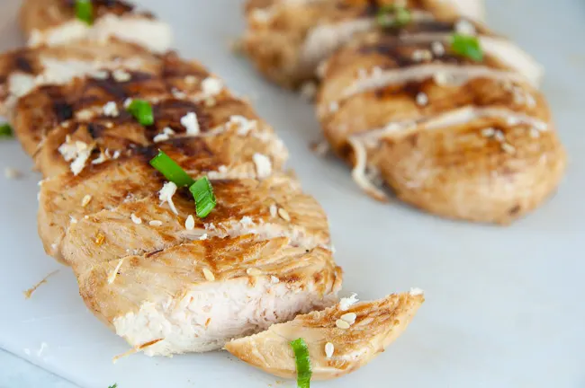 Slice the grilled chicken breasts for the mandarin chicken salad