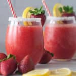 Boozy strawberry lemonade slushies make a fun drink for summer.