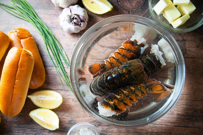 Ingredients for a lobster roll with no mayonnaise: lobster, hot dog rolls, butter, lemon, seasoning