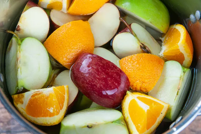 Add the fruit to a large stock pot and cover it with water.