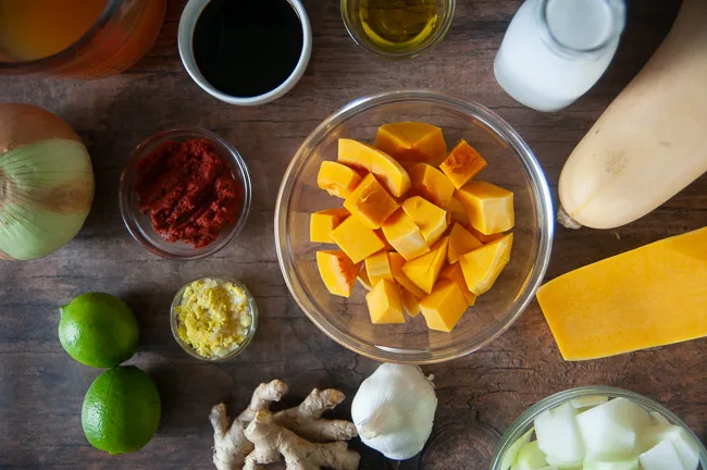 Ingredients for Instant Pot Curried Butternut Squash Soup: butternut squash, soy sauce, coconut milk, garlic, ginger, curry paste, onion, and vegetable broth