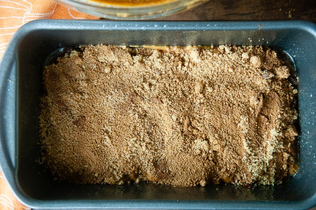 Cinnamon Swirl layer sits on top of a layer of moist pumpkin bread in a loaf pan