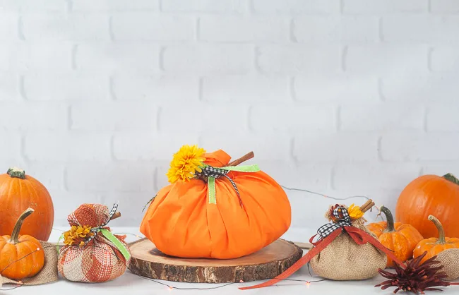 Easy No Sew Fabric Pumpkins on a white background