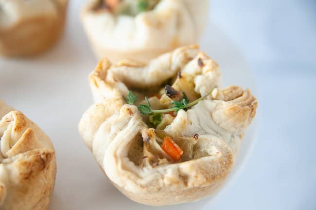 Chicken pot pie muffins on a white plate