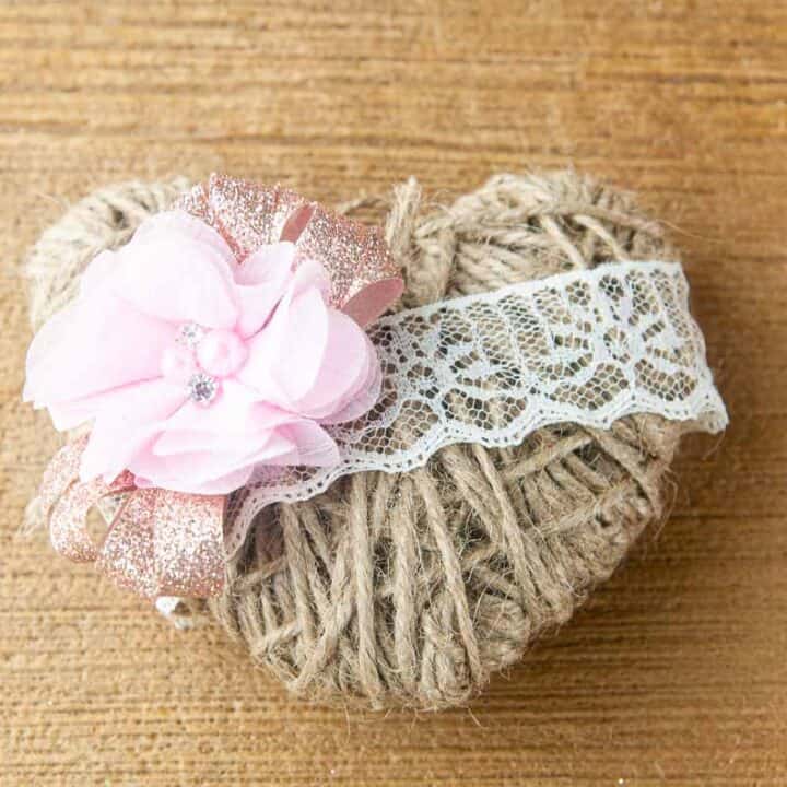 A twine heart on wood.