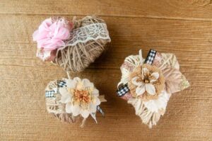 Three Different DIY Twine Hearts on Wood. Change up the embellishment to suit different occasions and make rustic farmhouse decor for weddings, Valentine's Day, spring or even Christmas.