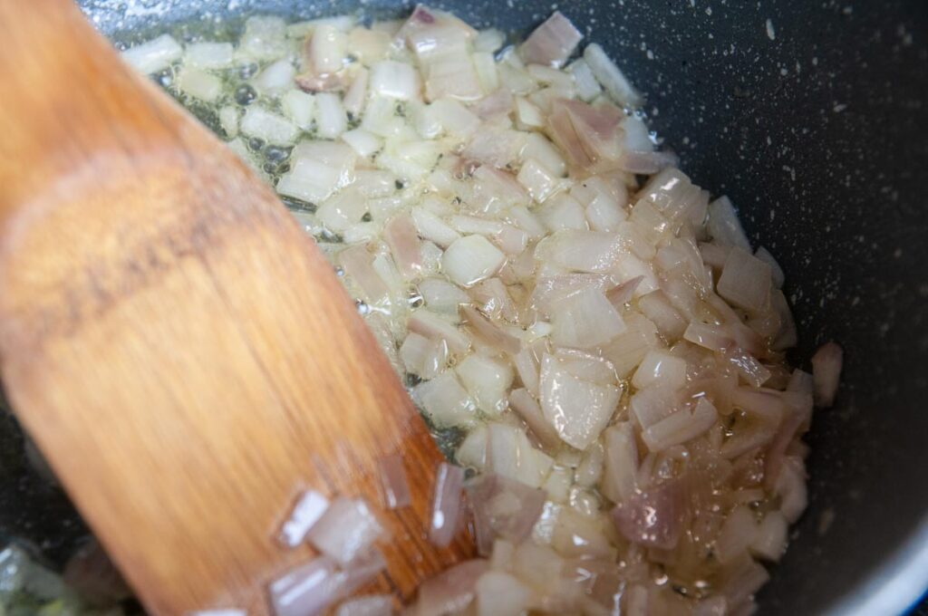 Cooking shallots and garlic for lobster risotto