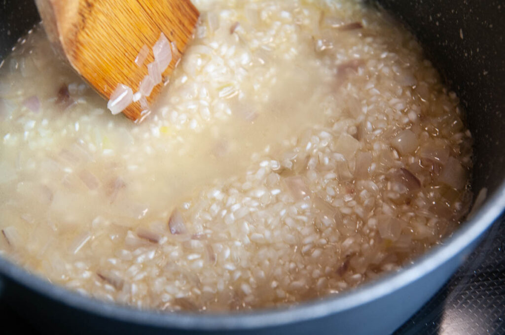 Stiring risotto as it cooks