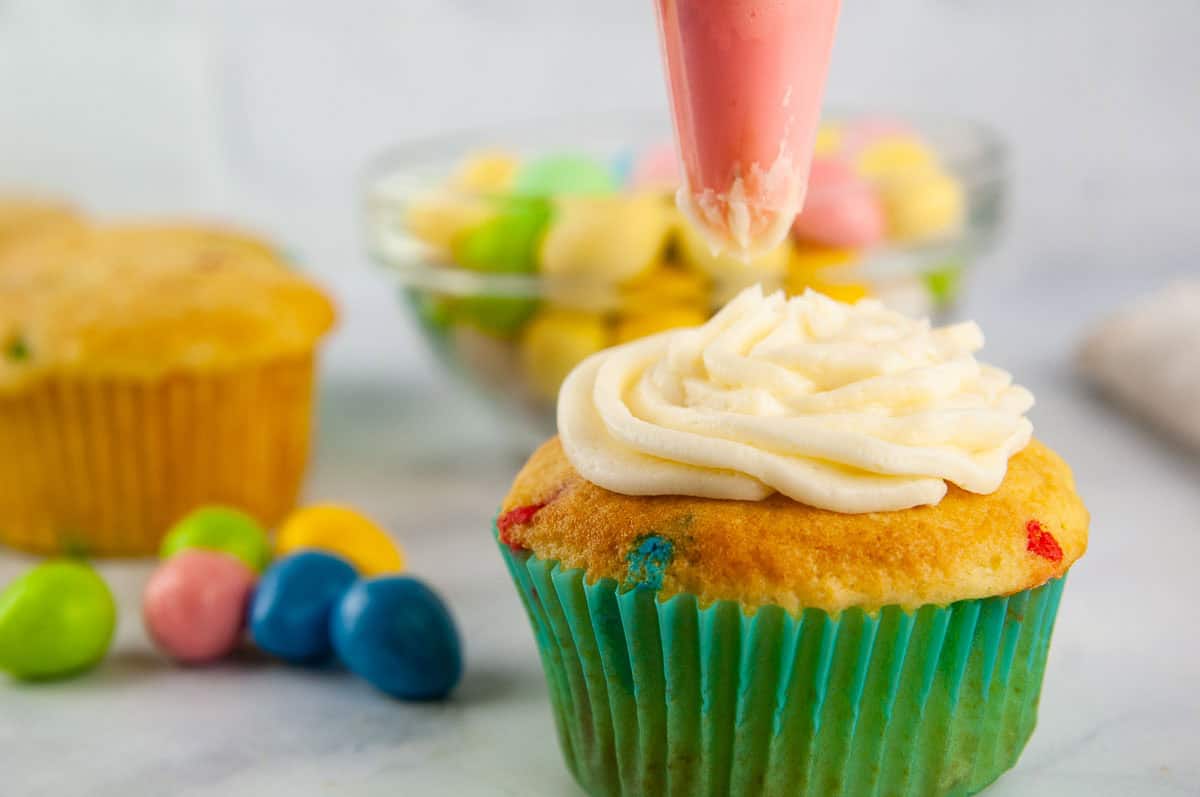 Frost the cupcakes before you decorate them.