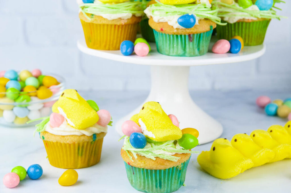 Easter Peeps Cupcakes look like sweet little egg nests with fluffy yellow chicks. Perfect project for the kids.