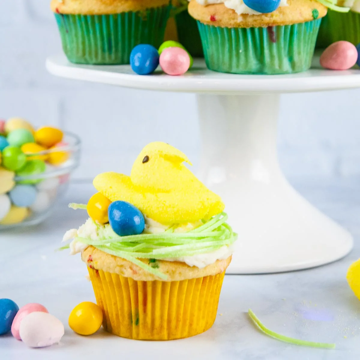 Easter Peeps Cupcakes look like sweet little egg nests with fluffy yellow chicks. Perfect project for the kids.