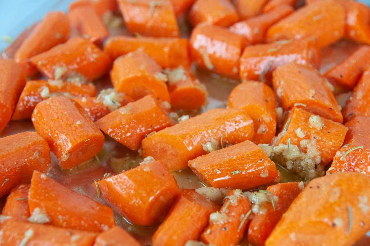 Spread the seasoned carrots out on a prepared baking sheet.