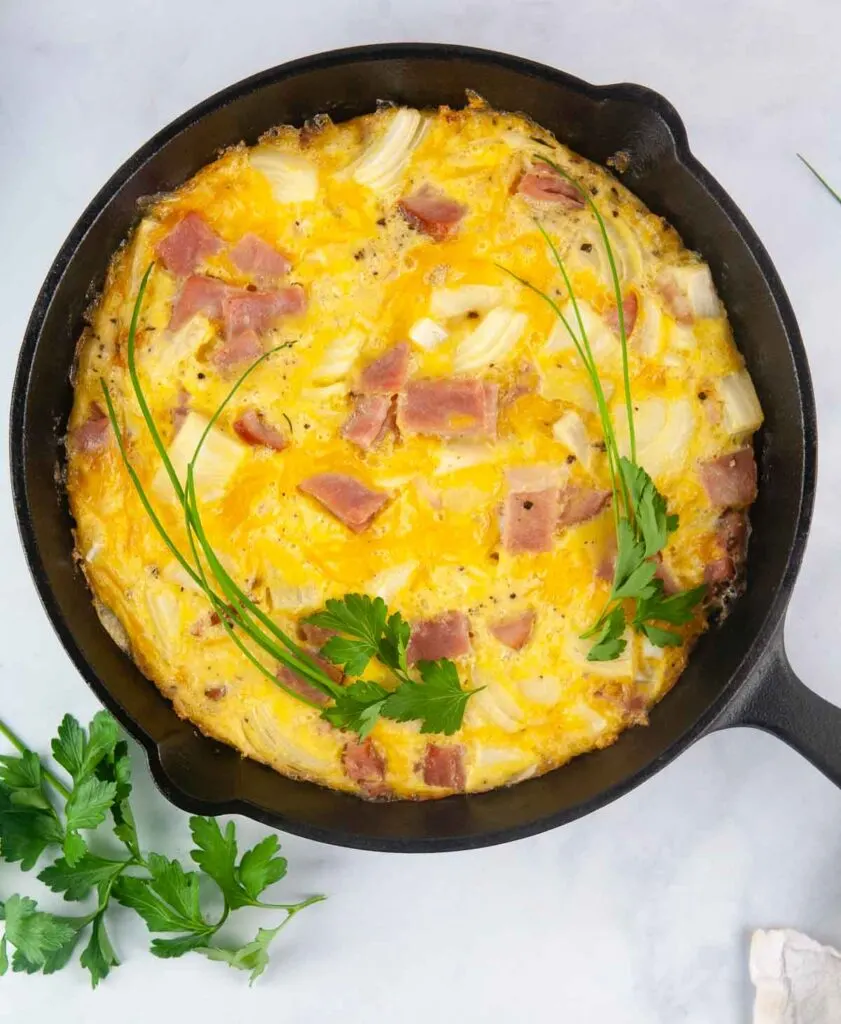 https://www.seasonedsprinkles.com/wp-content/uploads/2021/03/Ham-and-Cheese-Frittata-Ham-and-Cheese-Crustless-Quiche-7-841x1024.jpg.webp